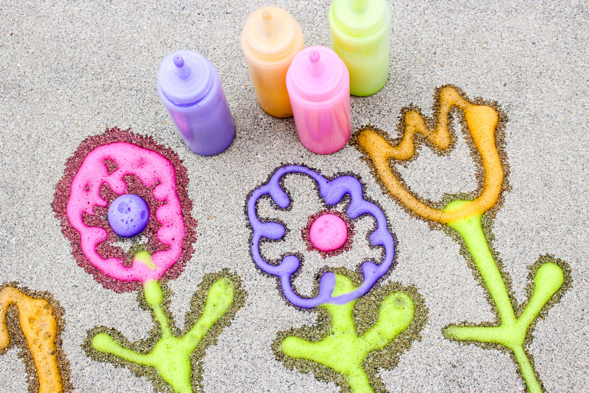 Make super easy foamy sidewalk paint - an awesome liquid sidewalk chalk recipe that's perfect for cold weather too! This outdoor art activity for kids is super easy and inexpensive, can be done in the winter, can be used to paint snow, can be carried over as a spring or summer activity too - basically, you can do anything with it!