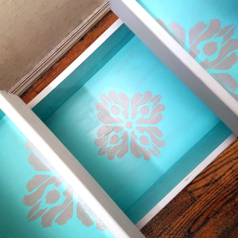 Open up for a cool surprise! Update a vintage sewing box with this cool DIY makeover using stencils. The top says "create" and there are beautiful patterns inside - you simply won't believe that this was a flea market find! One of my favorite thrift store makeovers and trash to treasure DIY projects ever, and perfect for craft room organization.