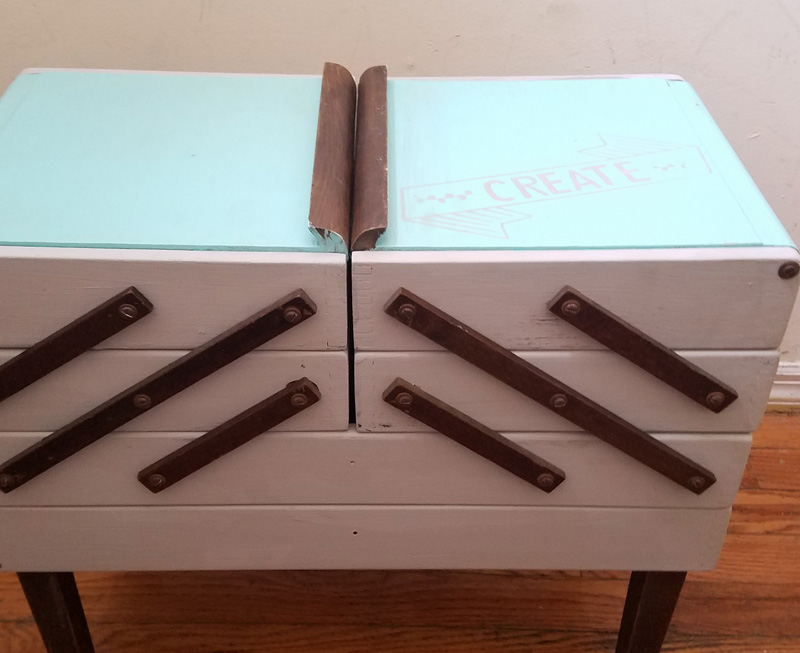 Open up for a cool surprise! Update a vintage sewing box with this cool DIY makeover using stencils. The top says "create" and there are beautiful patterns inside - you simply won't believe that this was a flea market find! One of my favorite thrift store makeovers and trash to treasure DIY projects ever, and perfect for craft room organization.