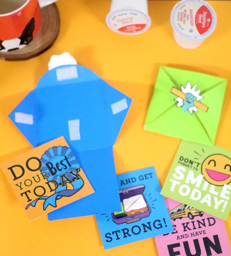Want to send your kid off with lunch box notes but don't have time? Get these free back to school printables and create this "lazy lunch box notes" system so that you can drink your coffee HOT! Just swap out the note inside and recycle as needed. Your little one will still feel special with the small memento from mom. Both you and your child will have the best first day of school ever!