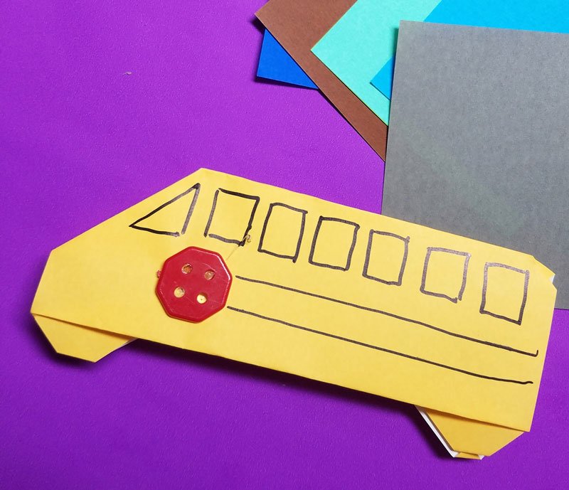 Make an origami bus - an adorable little school bus paper craft for kids - it is totally an origami tutorial for beginners and super easy. Use it to embellish any back to school craft. #backtoschool #papercraft #origami