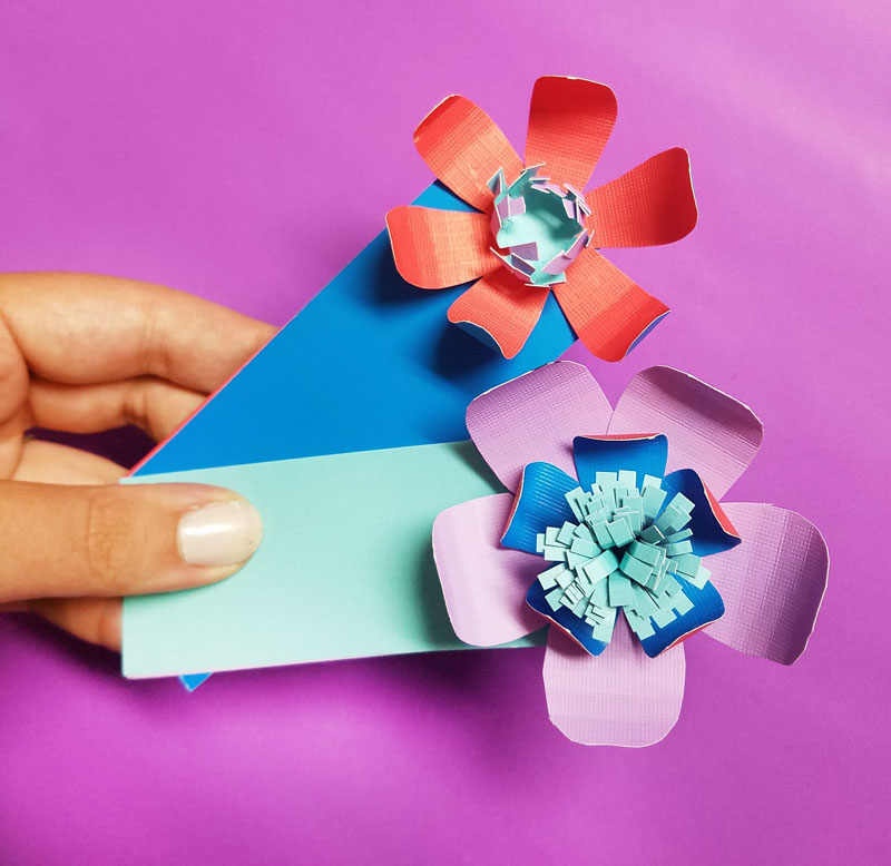 Craft these beautiful paper flower bookmarks - an easy paper craft for kids and teens! You'll love these easy DIY flowers made from cardstock and placing them on a bookmark helps kids love to read and promotes literacy.