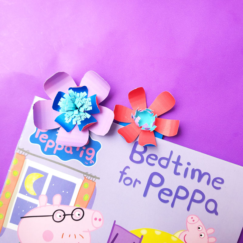 Craft these beautiful paper flower bookmarks - an easy paper craft for kids and teens! You'll love these easy DIY flowers made from cardstock and placing them on a bookmark helps kids love to read and promotes literacy.