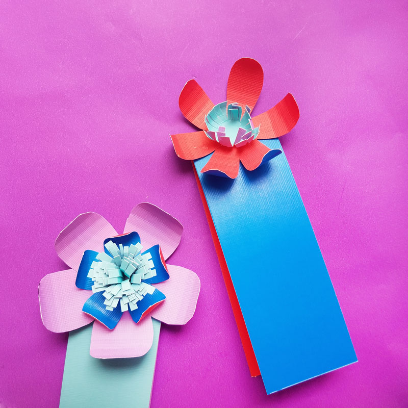 Craft these beautiful paper flower bookmarks - an easy paper craft for kids and teens! You'll love these easy DIY flowers made from cardstock and placing them on a bookmark helps kids love to read and promotes literacy.