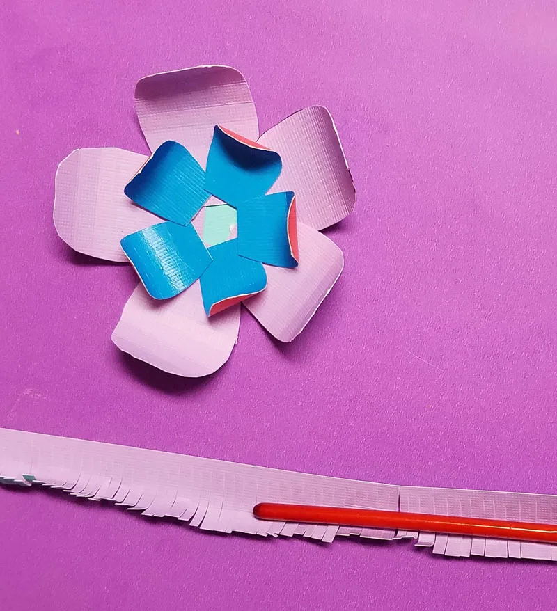Craft these beautiful paper flower bookmarks - an easy paper craft for kids and teens! You'll love these easy DIY flowers made from cardstock and placing them on a bookmark helps kids love to read and promotes literacy.