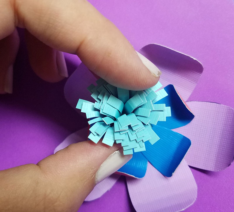 Craft these beautiful paper flower bookmarks - an easy paper craft for kids and teens! You'll love these easy DIY flowers made from cardstock and placing them on a bookmark helps kids love to read and promotes literacy.