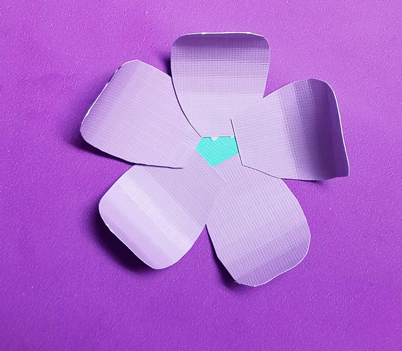 Craft these beautiful paper flower bookmarks - an easy paper craft for kids and teens! You'll love these easy DIY flowers made from cardstock and placing them on a bookmark helps kids love to read and promotes literacy.