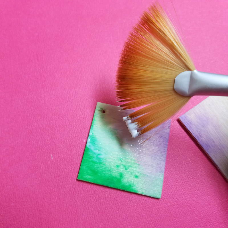 Make these stunning DIY earrings with a watercolor finish and some cool doodles! You'll love this beginner jewelry making project for teens and tweens to enjoy.