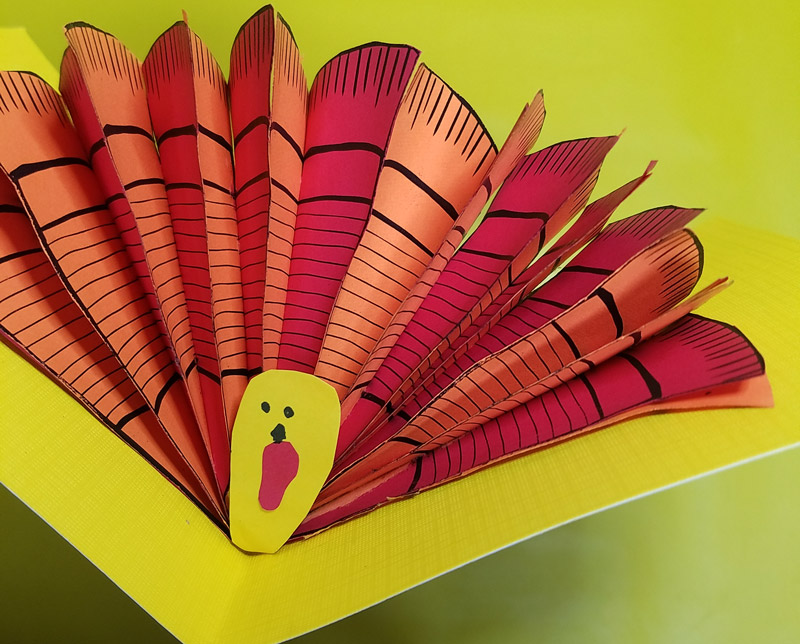 These free printable turkey feathers are so versatile and perfect for yoru Thanksgiving crafts for adults and for kids! You can make a pop up card with them or any Thanksgiving turkey paper craft