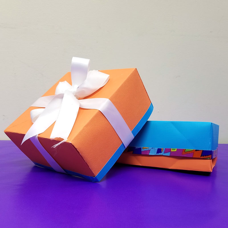 Make this easy DIY gift box from a single sheet of scrapbook paper - isn't that a super cool papercraft for Christmas or Hanukkah - or for gifts any time of year? I love this easy gift wrap idea and paper crafts for kids, teens, tweens, or adults. #papercraft #origami #papercrafts #diy #giftbox