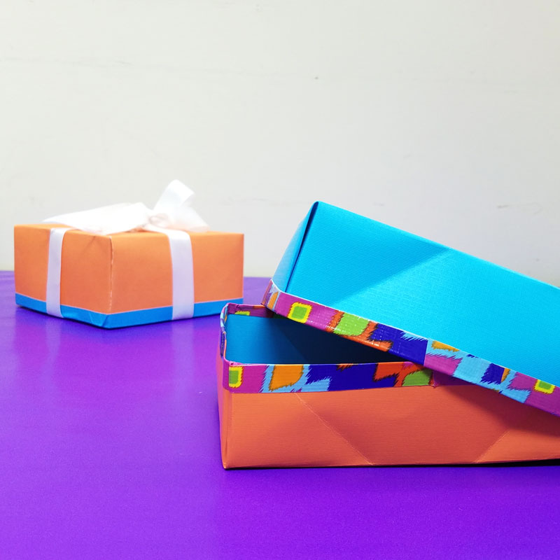 Make this easy DIY gift box from a single sheet of scrapbook paper - isn't that a super cool papercraft for Christmas or Hanukkah - or for gifts any time of year? I love this easy gift wrap idea and paper crafts for kids, teens, tweens, or adults. #papercraft #origami #papercrafts #diy #giftbox