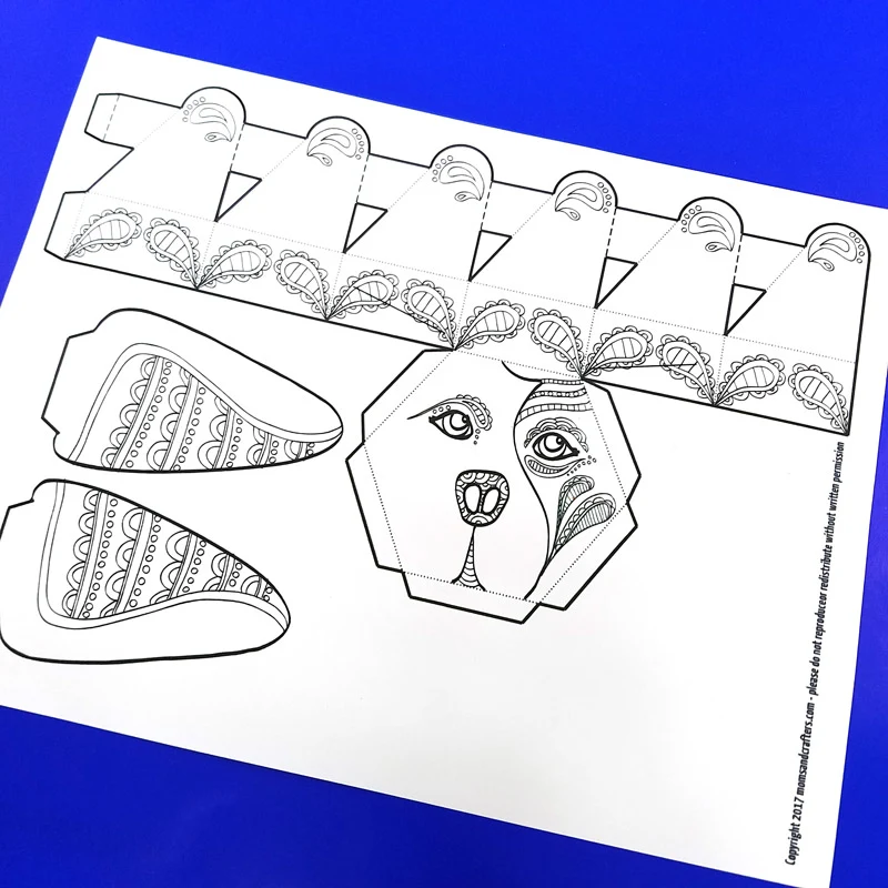 This adorable free printable dog coloring page for adults turns into a dog box for treats and small gifts! It's a cute way to gift money, or a jewelry box for dog lovers. You'll love this easy paper craft for adults! #adultcoloring #coloring #papercraft #papercrafts #diy #dogs