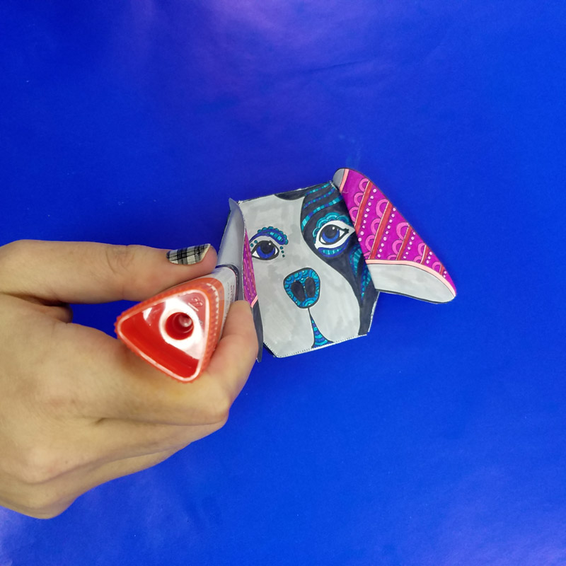 This adorable free printable dog coloring page for adults turns into a dog box for treats and small gifts! It's a cute way to gift money, or a jewelry box for dog lovers. You'll love this easy paper craft for adults! #adultcoloring #coloring #papercraft #papercrafts #diy #dogs