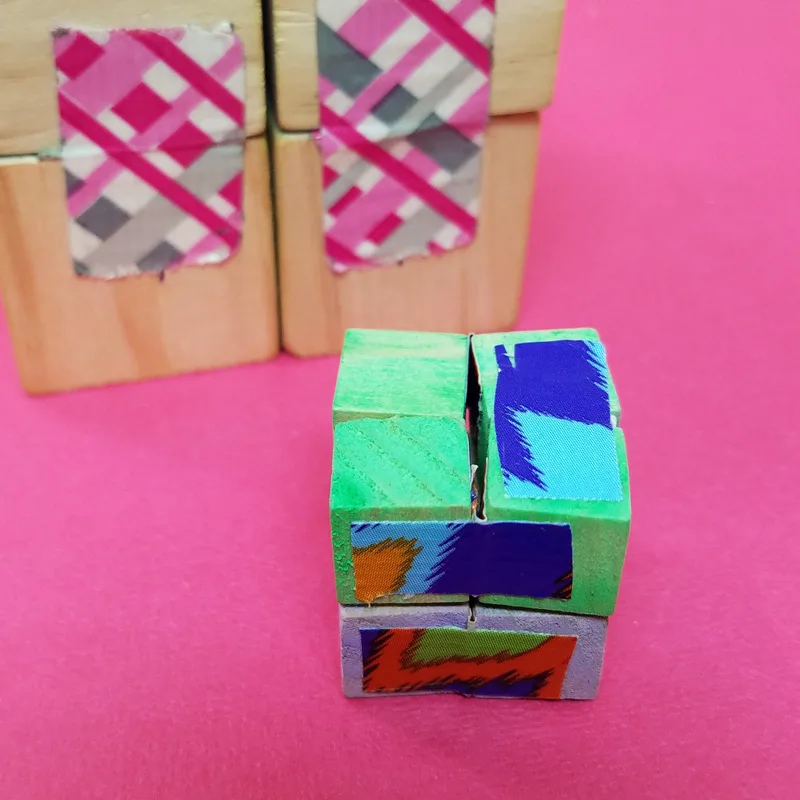 Make this wooden DIY infinity cube - an addictive fidget toy for kids and grown-ups! You'll love this DIY fidget spinner craft alternative - it's great for antsy kids and adult swho need to do something with their hands #fidgettoy #fidgetspinner #infinitycube #diytoy #fidget #diy #craft