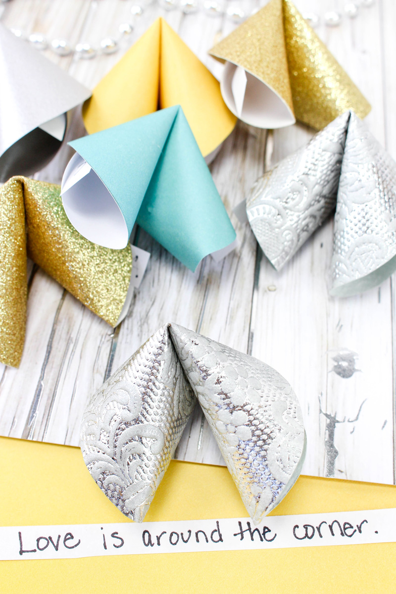 Make these super easy DIY paper fortune cookies - a super cool and simple (and cheap) DIY craft for teens and tweens. Perfect for new years eve celebrations or for any party or just for fun! #Newyearseve #newyear #papercraft #papercrafts #paper