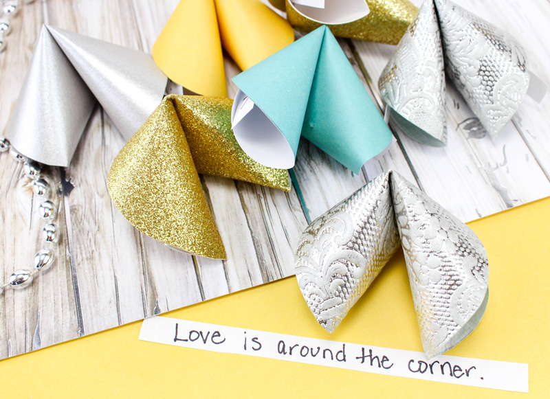 Make these super easy DIY paper fortune cookies - a super cool and simple (and cheap) DIY craft for teens and tweens. Perfect for new years eve celebrations or for any party or just for fun! #Newyearseve #newyear #papercraft #papercrafts #paper