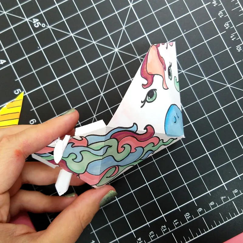 This adorable unicorn paper craft is quite unique - get the free color-in template coloring page for adults (or kids) and then assemble this super easy craft! You can turn it into a baby mobile if you'd like too, for adorable unicorn nursery decor. #unicorns #unicorn #papercraft #papercrafts #coloringpages #adultcoloring