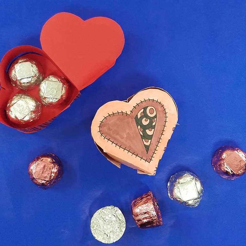 Grab the free printable template and craft this adorable heart box for Valentine's Day. This origami heart box is a sweet little DIY chocolate box and adult coloring page (perfect for big kids, tweens, and teens too!) for Valentines Day or your anniversary. #adultcoloring #papercraft #valentinesday