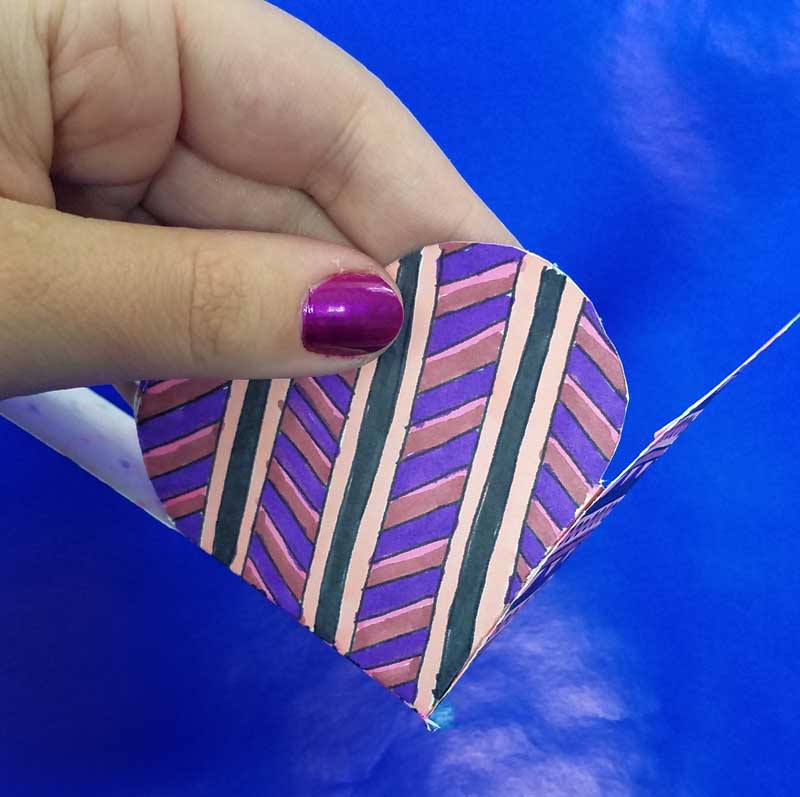 Grab the free printable template and craft this adorable heart box for Valentine's Day. This origami heart box is a sweet little DIY chocolate box and adult coloring page (perfect for big kids, tweens, and teens too!) for Valentines Day or your anniversary. #adultcoloring #papercraft #valentinesday
