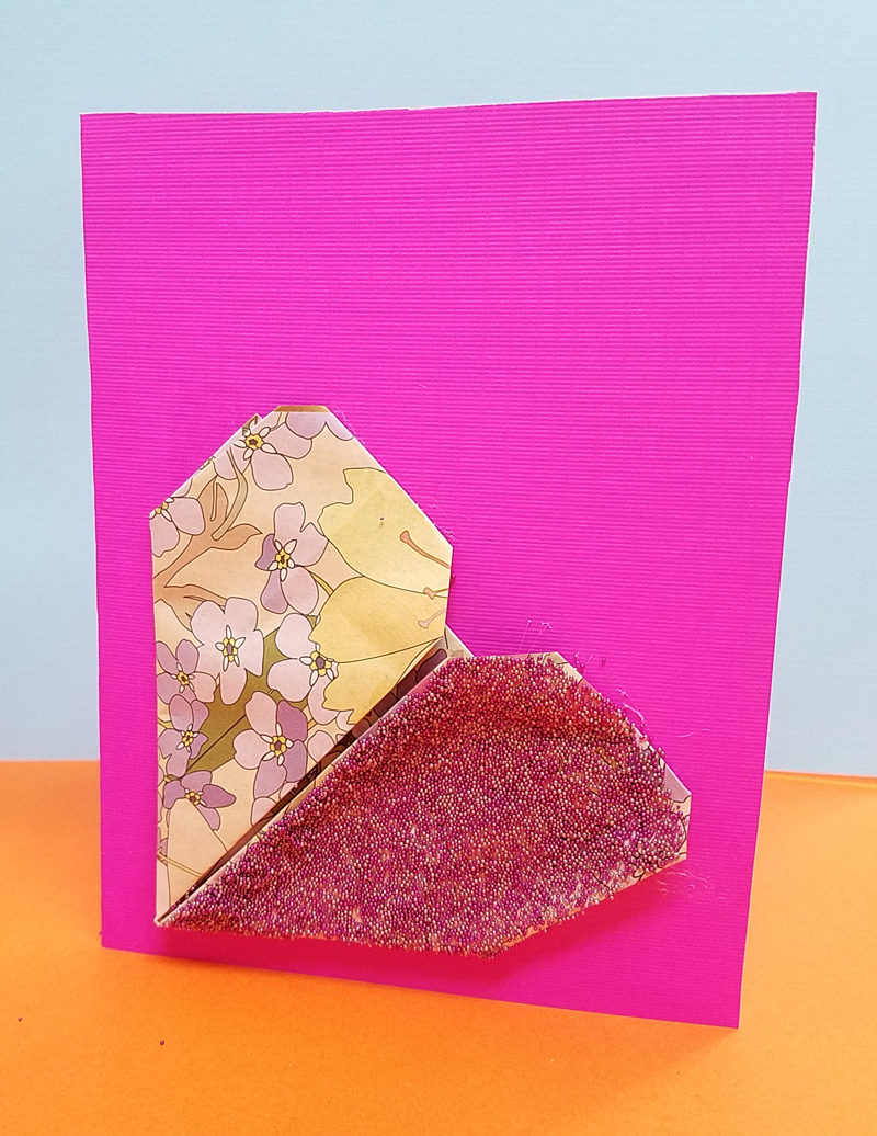 Make this sweet little origami heart card craft - an easy and fun paper craft for tweens and the perfect valentine's day craft for teens too! #valentinesday #valentine #teencraft #tweencraft #papercraft #origami #heart