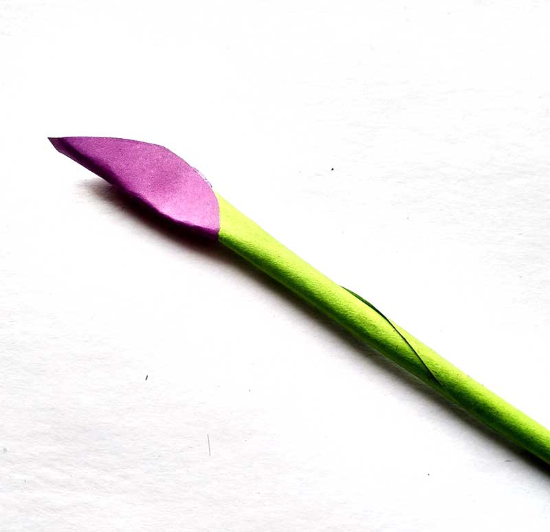 5. Crease your petal so that it’s completely folded around the paper stem.