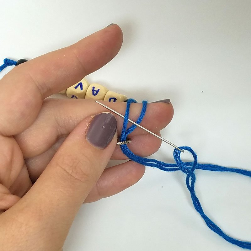 name keychains loop through a jump or split ring and slide side one through side 2