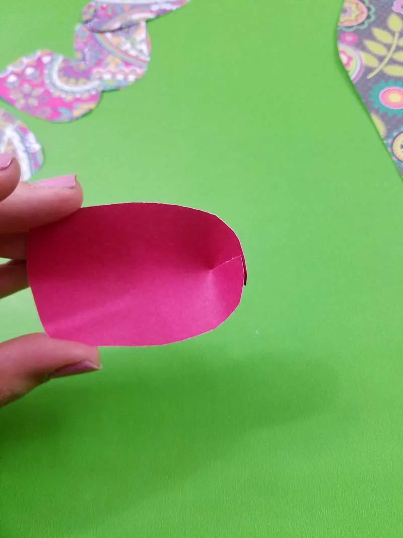 5. Tape the two sides of the paper tulips base together