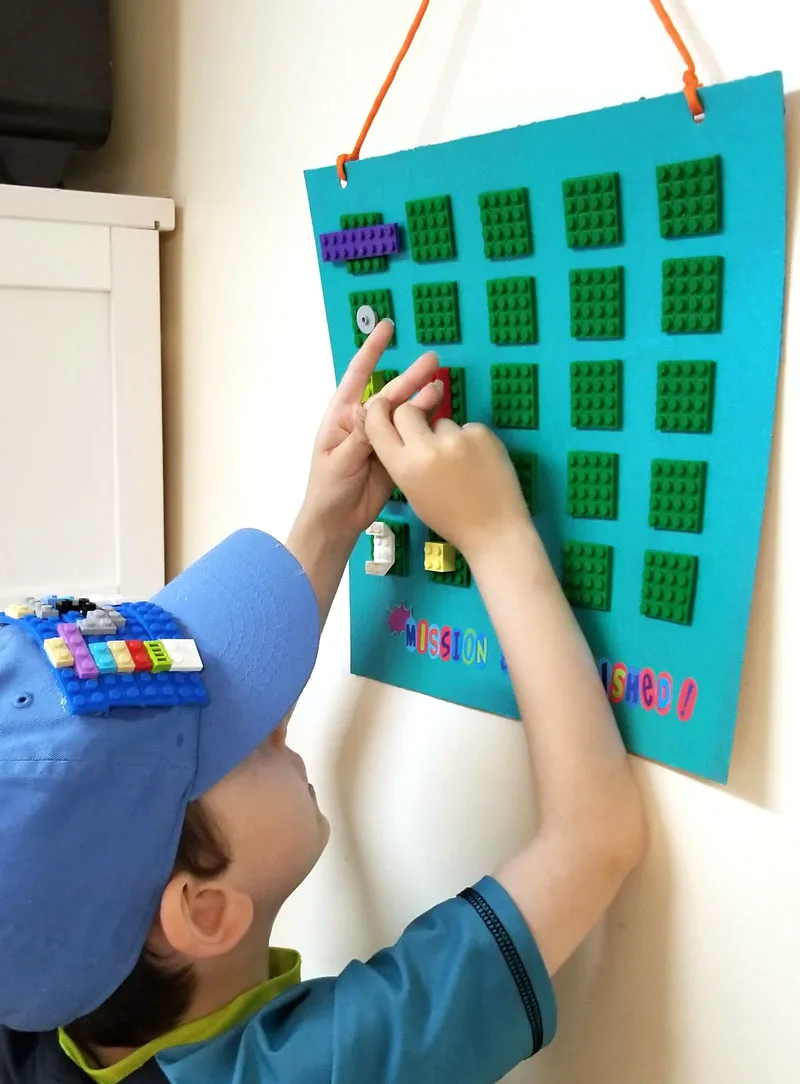 Allow your child to add his or her own bricks when they are earned to the DIY reward chart for kids.