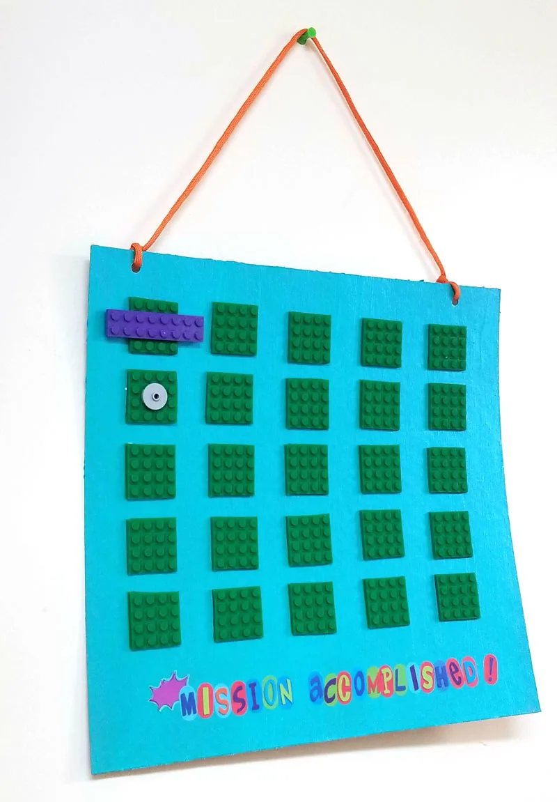 Punch holes and add string to your DIY reward chart for kids