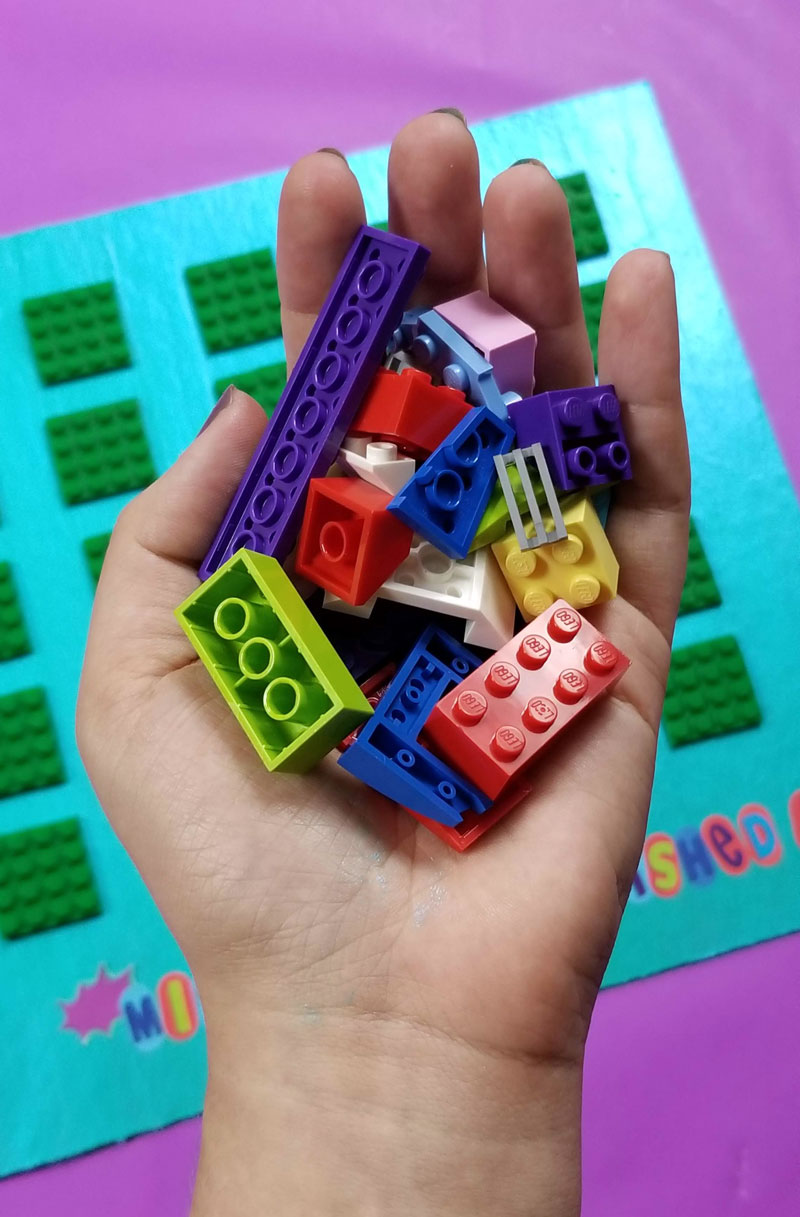 Click to find out how I made this super cool LEGO DIY reward chart for kids for my son to earn more bricks for his collection! This super cool LEGO craft has been working so well for us! #lego #legofan #kidscraft