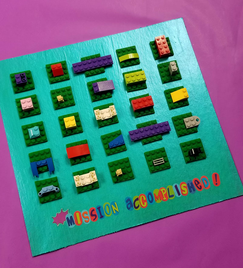 Click to find out how I made this super cool LEGO DIY reward chart for kids for my son to earn more bricks for his collection! This super cool LEGO craft has been working so well for us! #lego #legofan #kidscraft