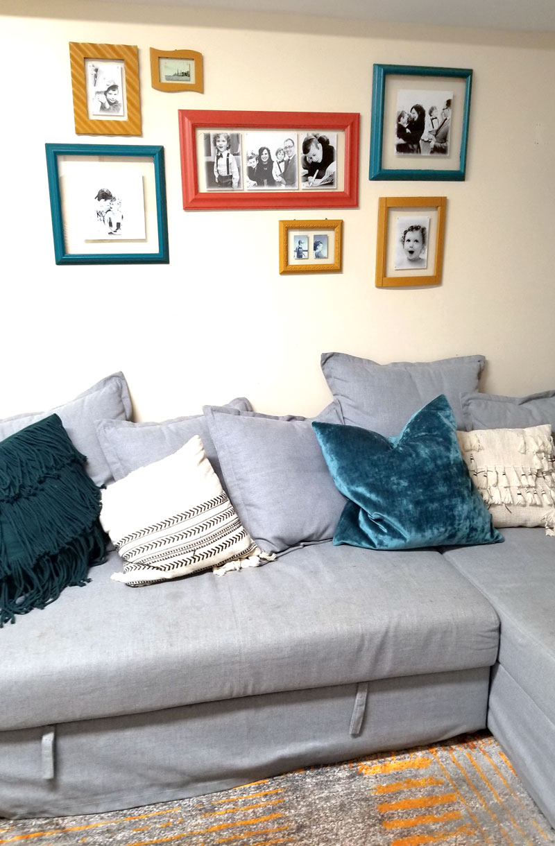 Family room DIY gallery wall from random upcycled frames and modern glass