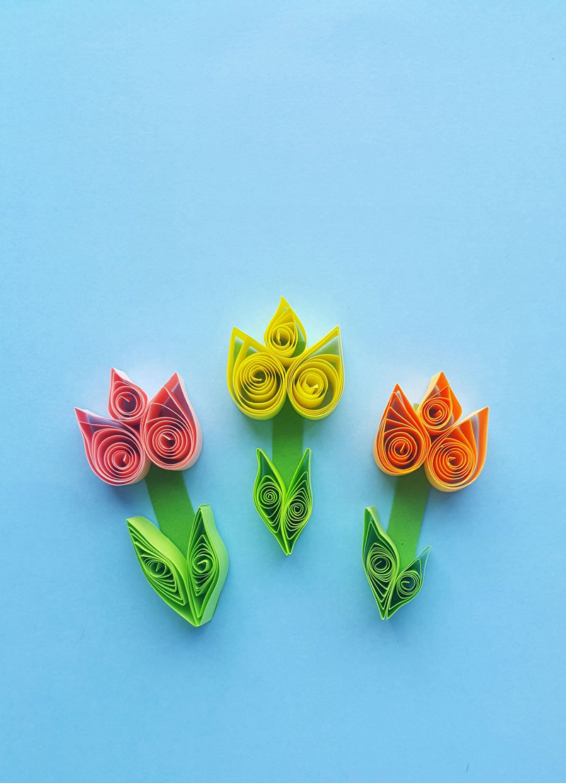 Click to learn how to make these gorgeous paper quilling tulips -a fun and easy beginner quilled paper flower tutorial and spring crafts for teens!