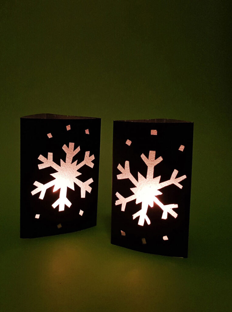 Craft an easy DIY snowflake lantern using paper! This fun paper lantern craft makes gorgeous christmas decor and is a fun paper craft for kids, or a beginner paper cutting craft for anyone