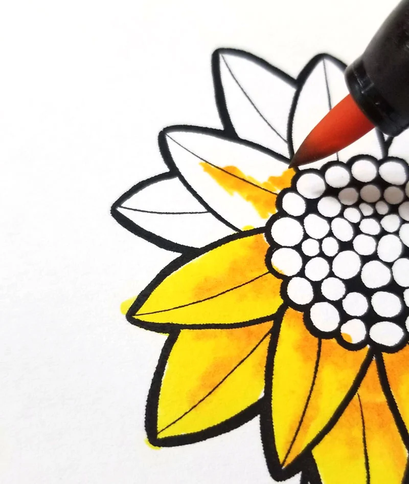 Shading sunflowers on motivational coloring pages step 2