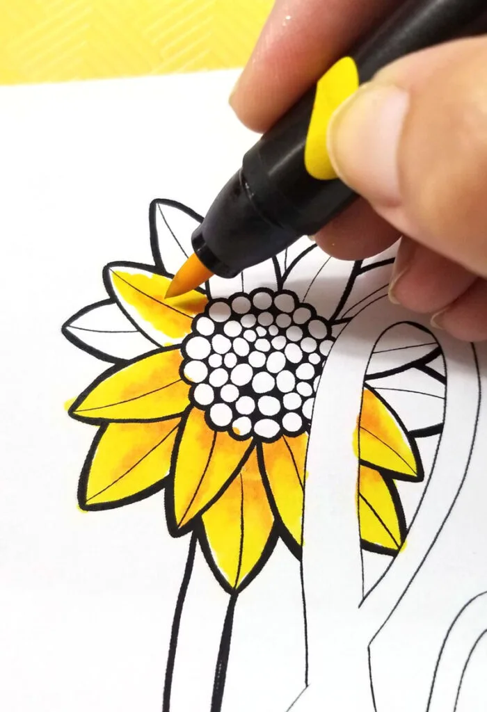 Shading sunflowers on motivational coloring pages step 2
