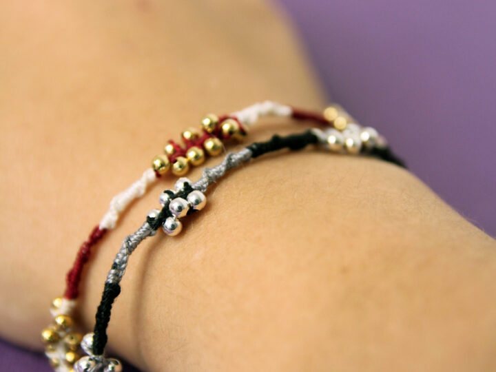 photo showing a hand modeling easy beaded friendship bracelets