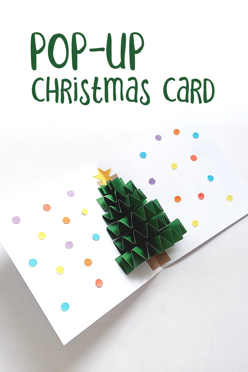 Christmas card craft for kids with a pop up accordion tree and text that says pop-up Christmas card
