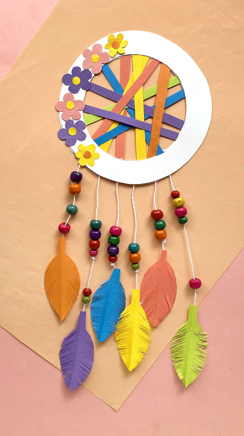 Make a dreamcatcher using fuse beads and feathers.