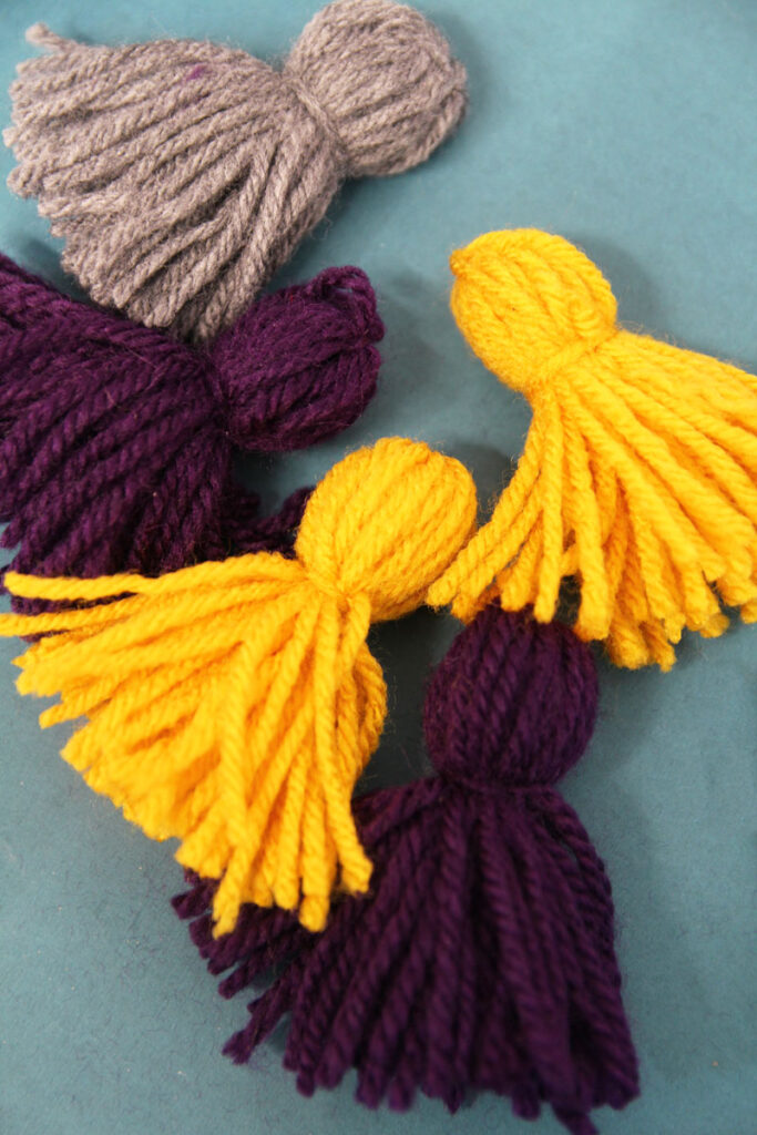 How to Make a Yarn Tassel Garland * Moms and Crafters