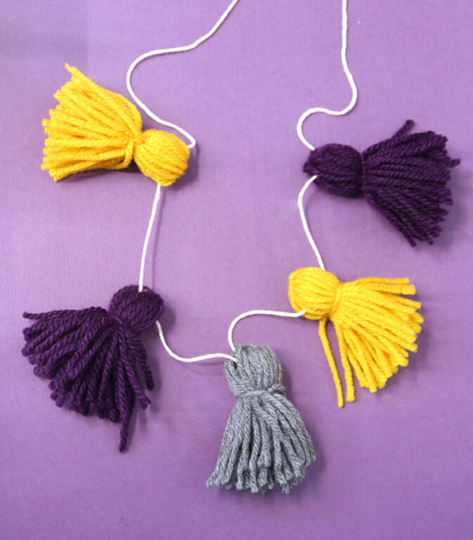 How to Make a Yarn Tassel Garland * Moms and Crafters